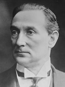 Retrato Rufus Daniel Isaacs, 1.º Marquês de Reading- By Bain - Library of Congress, Public Domain, https://commons.wikimedia.org/w/index.php?curid=46810242